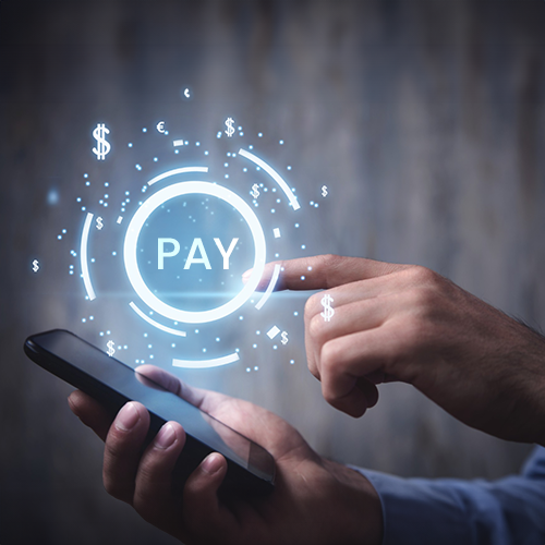 A Man Holding a Smartphone, Engaged in Bulk Payment Processing.