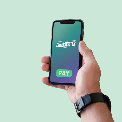 A Hand Holding Up a Phone, Facilitating a Bulk Payment System Transaction