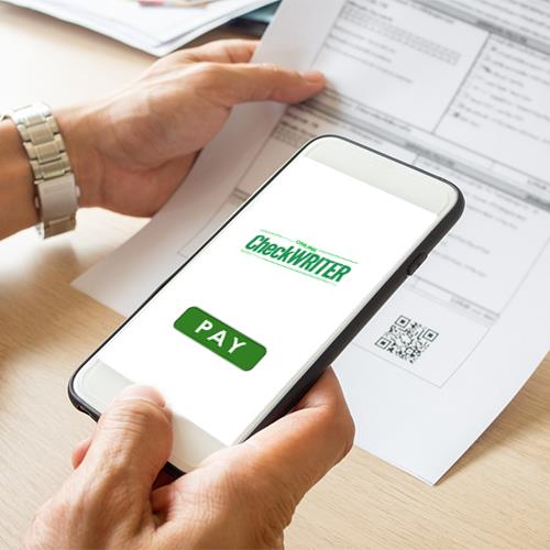 Pay Bill – Simplifying Your Financial Routine A Person Holding a Smartphone Displays the Word Pay on Its Screen, Signifying the Action to Pay Bill