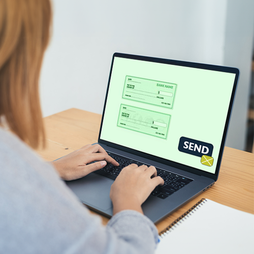 Woman Using a Laptop to Send a Check in the Mail