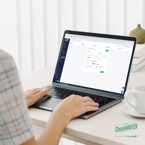 Person Using a Laptop Showing Check Writing Software on Screen, Experiencing Effortless Transactions and Unlocking the Power of Payment Links.