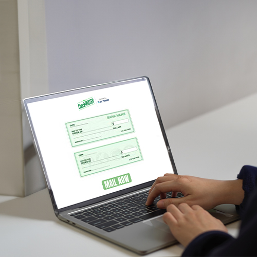 A Man Types on a Laptop. He Is Sending Checks by Mail Online