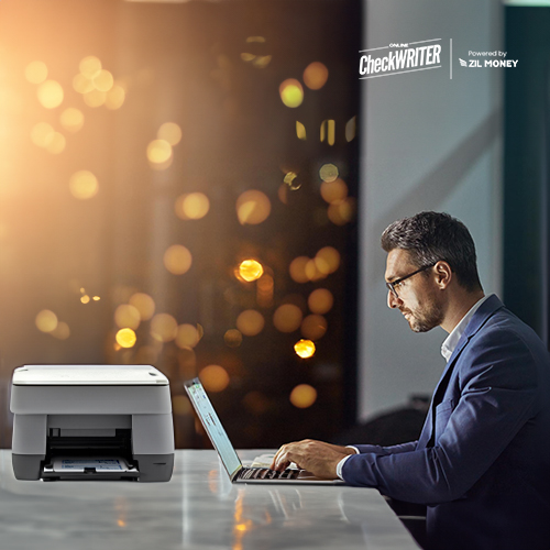 Instant Check Printing Solutions Instead of Pre-Printed Checks from Wells Fargo A Man Printing Checks Using A Regular Printer And Blank Paper. Instant Check Printing Solutions Instead of Pre-Printed Checks from Wells Fargo