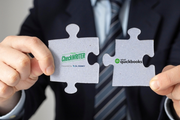 QuickBooks Integration Simplify Your Payroll Distribution A Man In a Suite Showing QuickBook Integration QuickBooks Integration Simplify Your Payroll Distribution