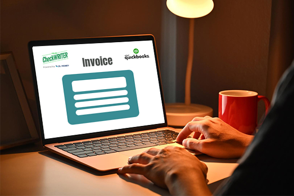 QuickBooks Invoice Payment – Streamlining Business Transactions A Person Working On Using His Laptop, That Shows QuickBooks Invoice Payment, Efficient Payment Solutions for Business