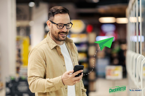 A Man Makes a Payment Via Check Mailing Using His Phone. Simplify Your Transactions