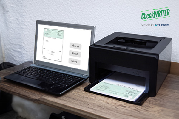 Online Check Printing Software: Simplify Payments for Thrift Stores A Printer And Laptop Creating And Printing Checks Using Online Check Printing Software