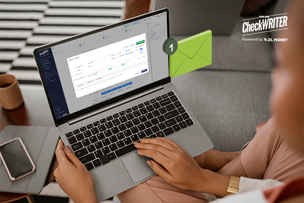 Online Check Printing and Mailing Solutions to Quicken Your Payment Process A Person Creating And Mail Checks Using A Laptop, Online Check Printing and Mailing Solutions to Quicken Your Payment Process