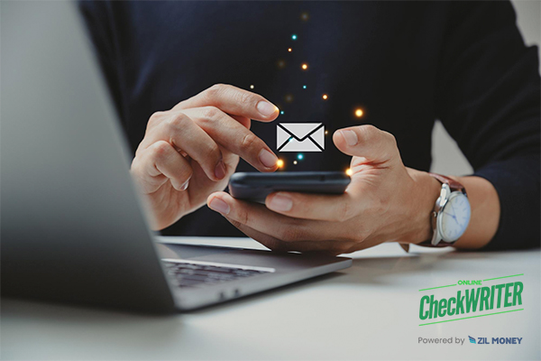 A Man Using A Phone To Make Check Mailing Process