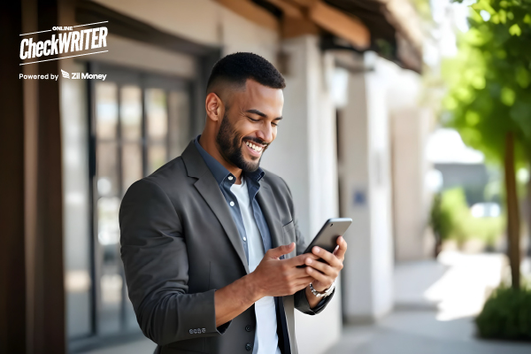 Sync Smarter, Pay Faster: NetSuite Integration Made Easy NetSuite Integration Shown in Action as a Smiling Businessman Uses a Mobile Phone Outdoors, Representing Seamless Bill Syncing and Payments on the Go.