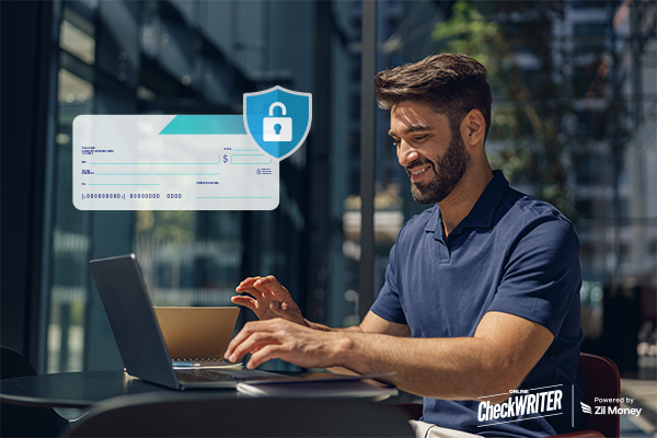 A Man Using a Laptop For Secure Check Payment Using Positive Pay.