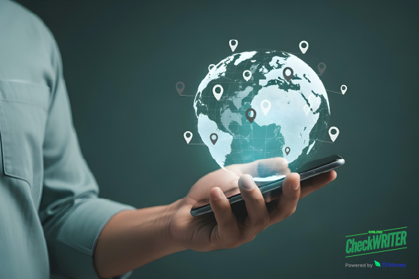 A Man Holding a Smartphone to Make International Payments, Simplify Cross-Border Transactions