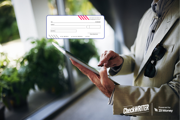 Built for Peace of Mind: How Positive Pay Is Powering Safer Business Payments A Man Using a Tablet to Make a Check Payment. Represents Positive Pay