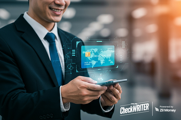 A Man Using A Credit Card and Phone. Manage Your Business Payments with a Virtual Card.