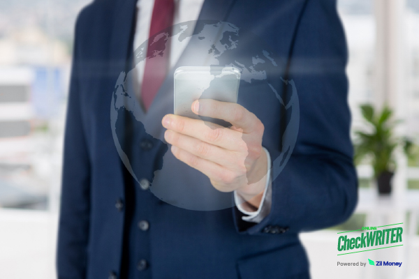 A Business Professional Using a Smartphone with a Digital Globe Overlay, Showing the Convenience of Handling International Payments Securely.