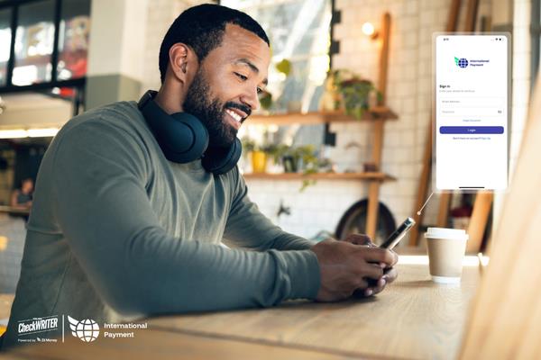 Why the Best Exchange Rate Should Be Your Top Priority for International Payments A Man Using A Mobile to Make an International Payment Solution. Real-Time Exchange Rates, Low Fees, and Instant Transfers for Business Needs