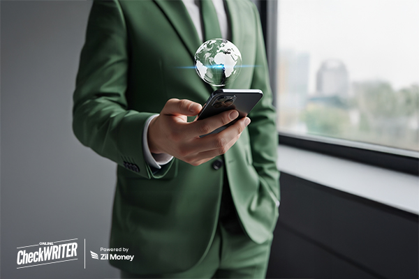 Instant International Payments: Getting Your Money to Sweden from the US in Minutes with OnlineCheckWriter.com – Powered by Zil Money A man in a green suit uses a smartphone, symbolizing fast and secure International Payments anywhere.