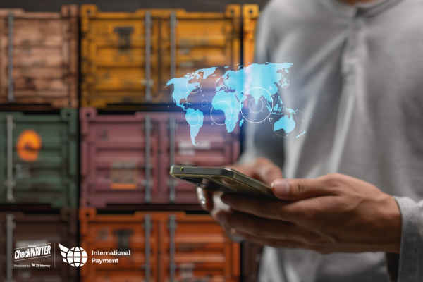 A Man Using A Phone to Make a Fast International Payment with Low Fees and Real-Time Tracking