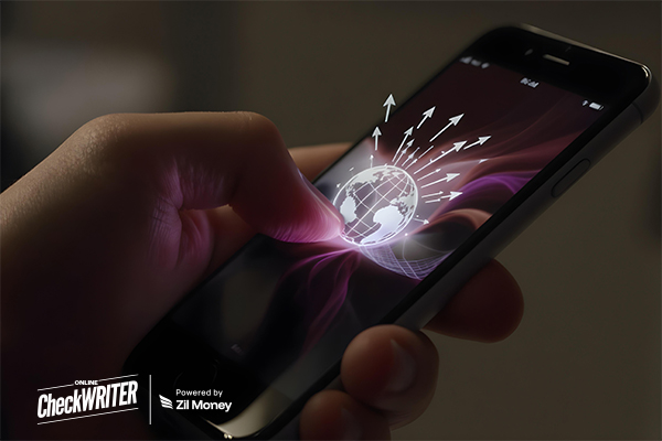 A Man Using a Phone to Make a Fast International Payment Using Mobile App Competitive Rates, and Full Transparency in Minutes