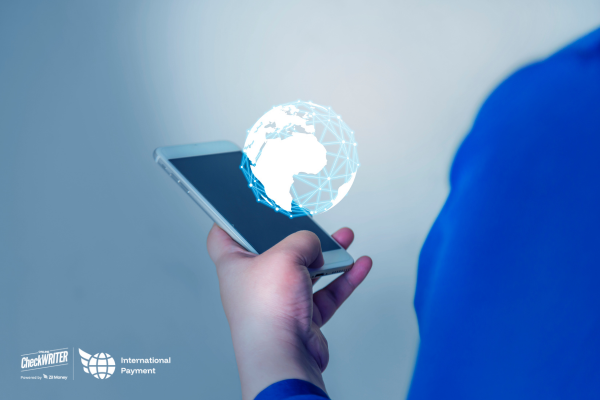 From Local to Global: Your 4-Step Guide to a Fast International Payments App for Seamless B2B Growth in 2025 A Man Using A Phone to Make Fast International Payments with Transparent Pricing and Real-Time Conversion Rates