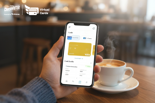 A person holds a phone in a coffee shop displaying a digital Virtual Card, suggesting easy, on-the-go payment control.