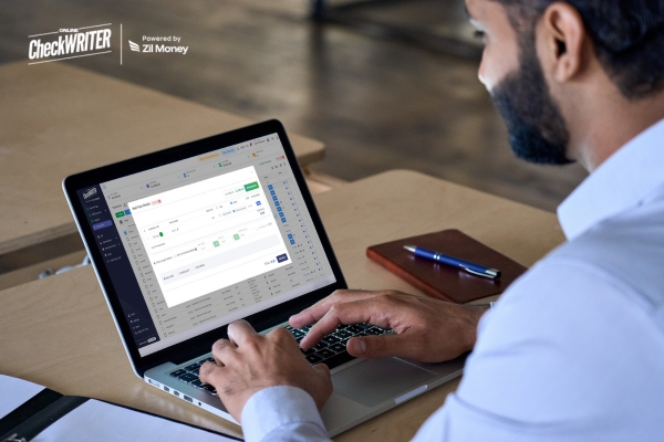 4 Steps to Success How the Right Check Mailing Service Boosts Profit and Productivity Today Man on a laptop using an online payment dashboard to set up Check Mailing, showing modern, secure payment processing.