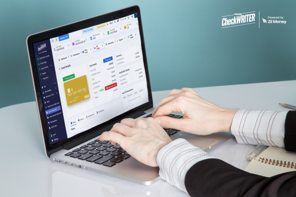 Employee Bonus Card A Smarter Way to Reward and Motivate Teams Hands typing on a laptop screen showing a dashboard for managing an Employee Bonus Card and transactions.