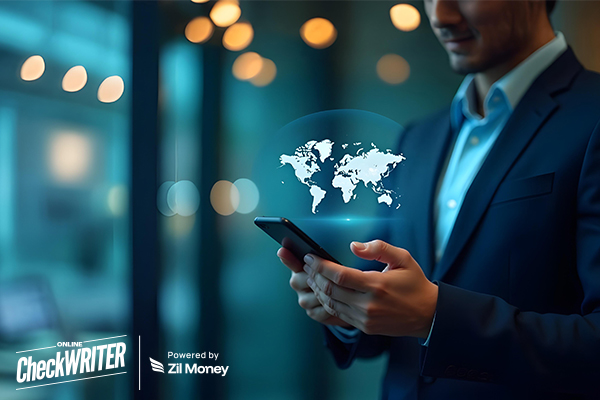 A person in a suit uses a phone with a glowing world map overlay, symbolizing the efficiency of Fast International Payments.