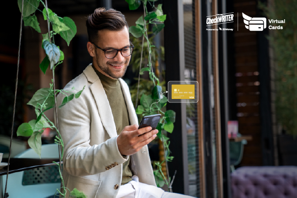 A Man Using A Phone And a Virtual Card to Make a Payment Easily. Gain Real-Time Control and Visibility with the Virtual Card App