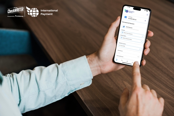 Breaking the Hidden Fee Culture Transparent Fast International Payments from Your Phone Man Using a Phone to Complete an International Payment Form, Illustrating the Process for Fast International Payments.