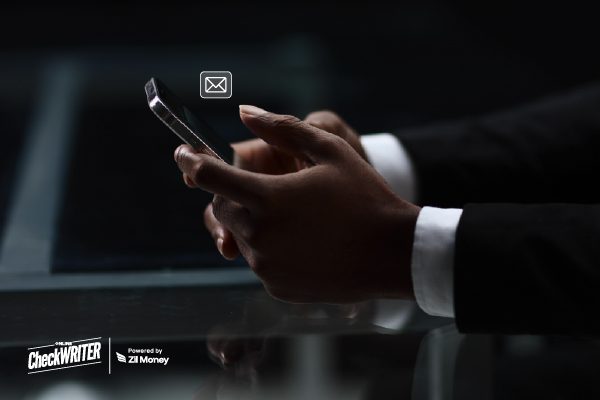 A Man Using A Phone to Make a Check Mailing Easily. Simplify Payments with Modern Check Mailing