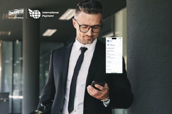 Practical Ways to Reduce the Cost of International Payments A Man Using A Mobile to Make a Payment Easily. Fast International Payments Help Businesses Cut Fees, Avoid Hidden Markups