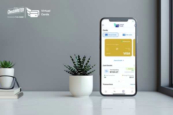 Smartphone displaying a Virtual Card app interface next to an office plant, symbolizing modern SMB finance.