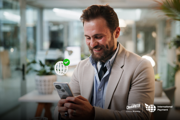 International Payments in 2025 How Fast, Transparent, and Secure Payments Became the New Standard A Man Holding a Smartphone Showing International Payments, International Payments in 2025 How Fast, Transparent, and Secure Payments Became the New Standard