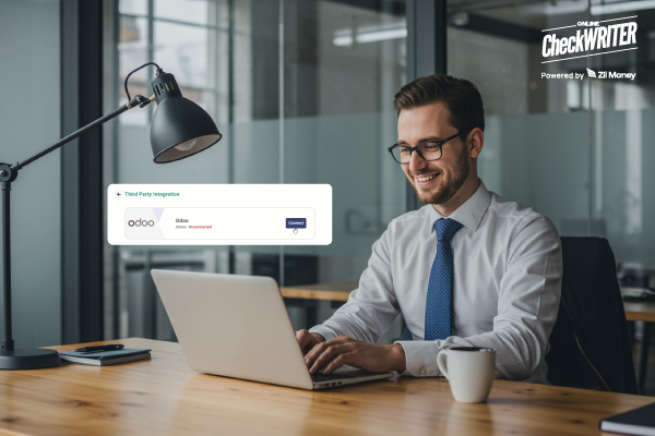 A Man Using A Laptop to Make a Payment Easily. Odoo Integration Keeping Payments Updated Correctly