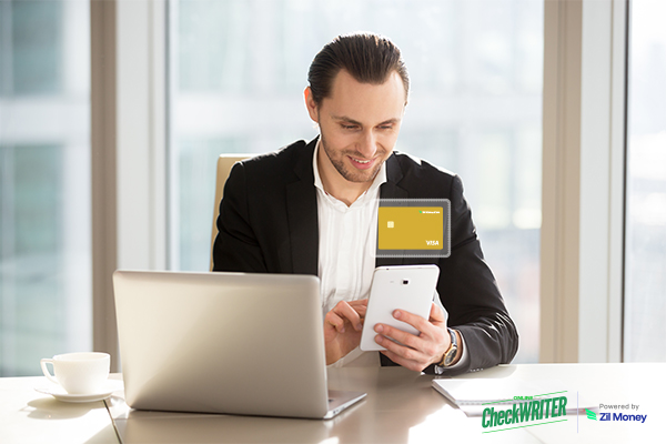 A Business Professional Using a Laptop and Smartphone to Activate an Instant Virtual Card for Fast and Secure Online Payments.